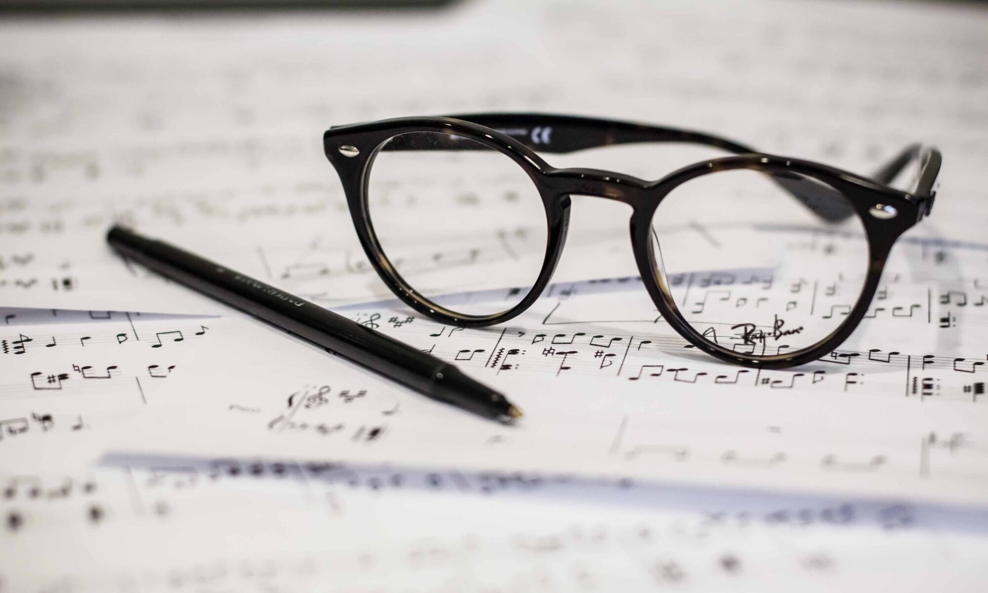 image of glasses resting on a score.